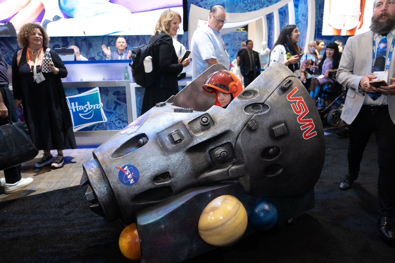 Boy sitting in NASA inspired rocket ship wheelchair. As part of the Magic Wheelchair initiative. 